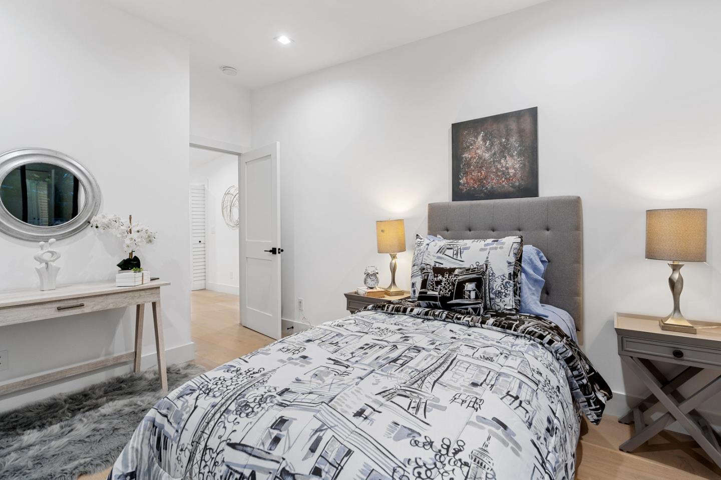 3633 Louis Road Palo Alto, CA 94303 - Photo 25 of 42 a bedroom with a bed and a lamp on dresser