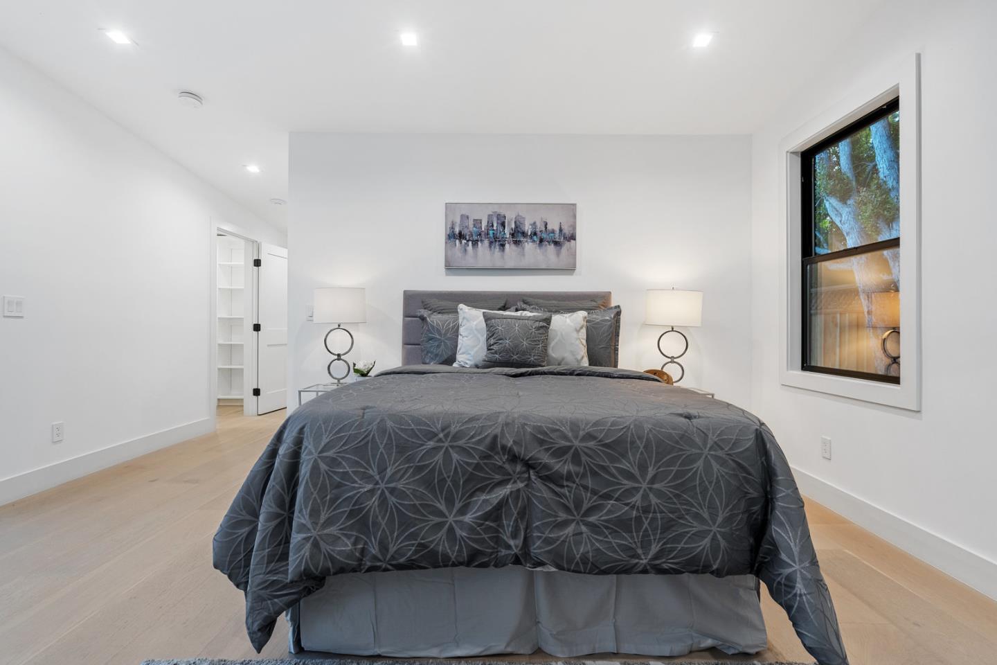 3633 Louis Road Palo Alto, CA 94303 - Photo 29 of 42 a bedroom with a bed and painting on the wall