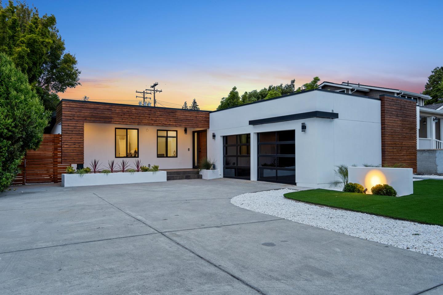 3633 Louis Road Palo Alto, CA 94303 - Photo 42 of 42 a front view of a house with a yard and garage