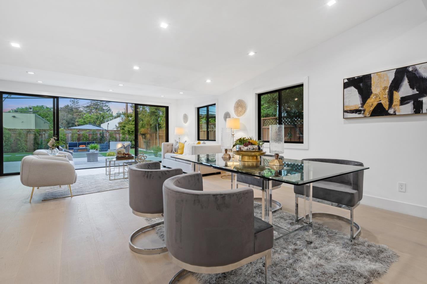 3633 Louis Road Palo Alto, CA 94303 - Photo 9 of 42 a living room with furniture a floor to ceiling window and potted plant