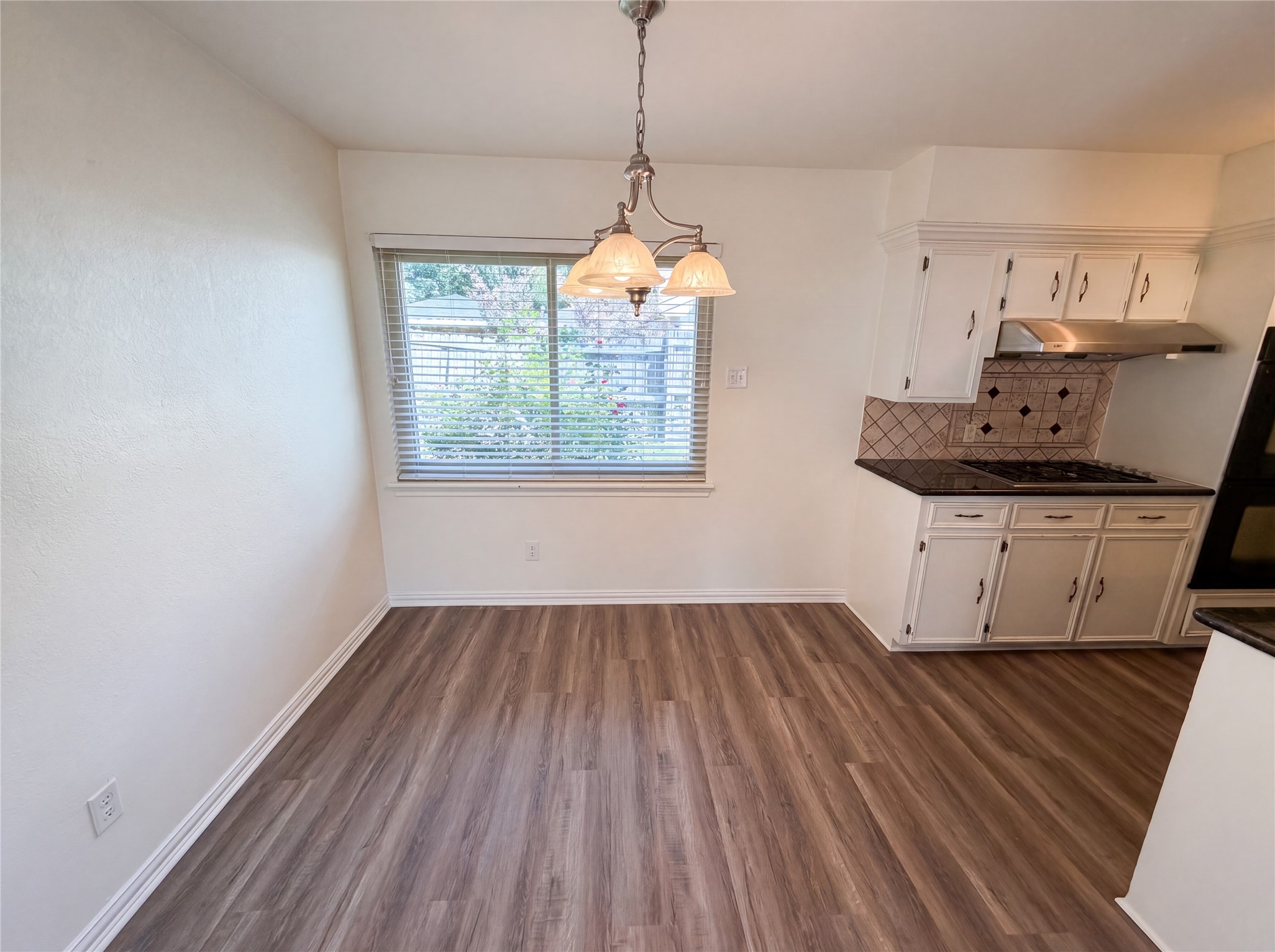 342 Queenstown Road Houston, TX 77015 - Photo 6 of 22 a room with wooden floor and windows