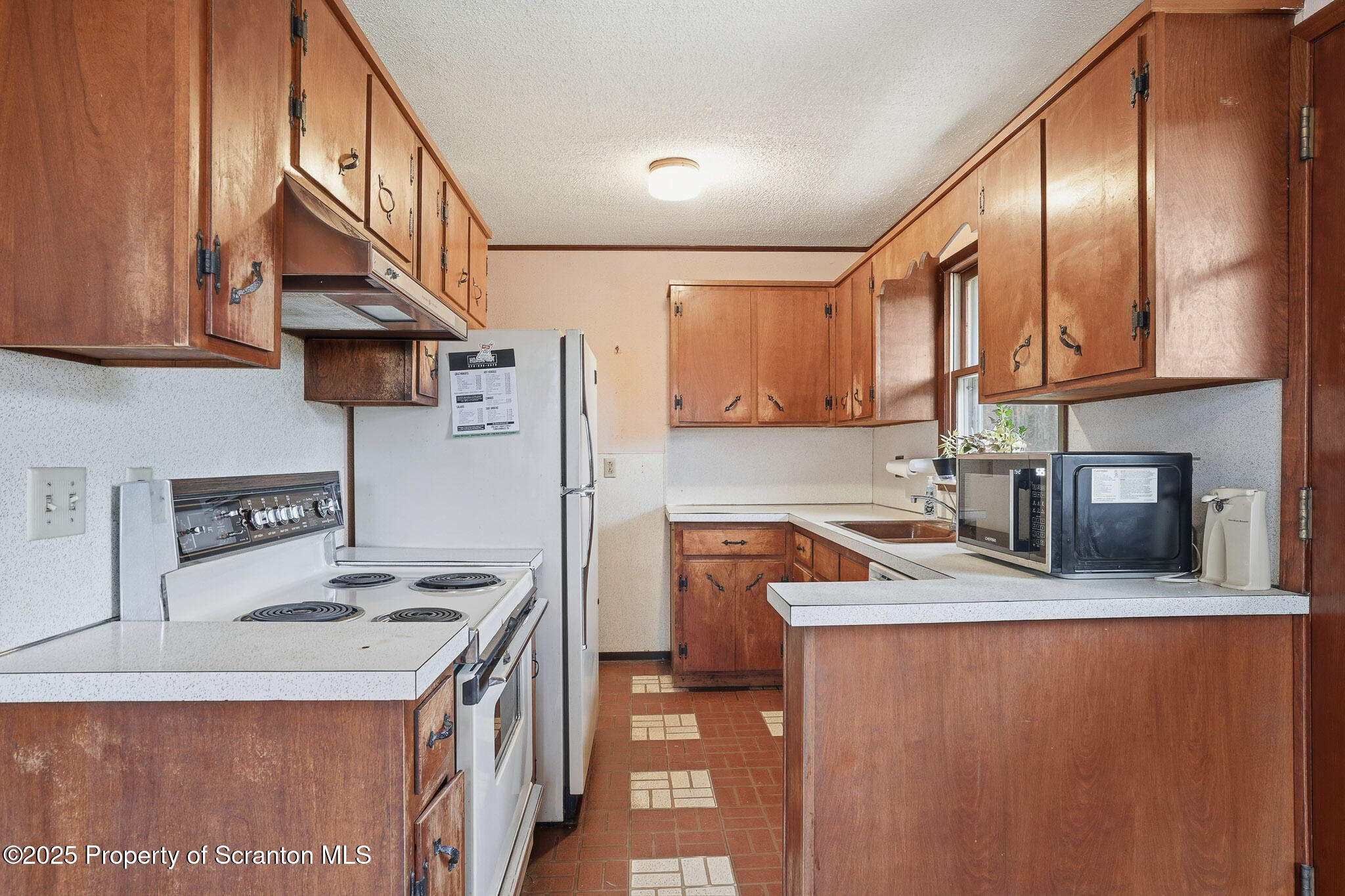 330 Pedrick Road Nicholson, PA 18446 - Photo 16 of 55 a kitchen with stainless steel appliances granite countertop a sink stove and refrigerator