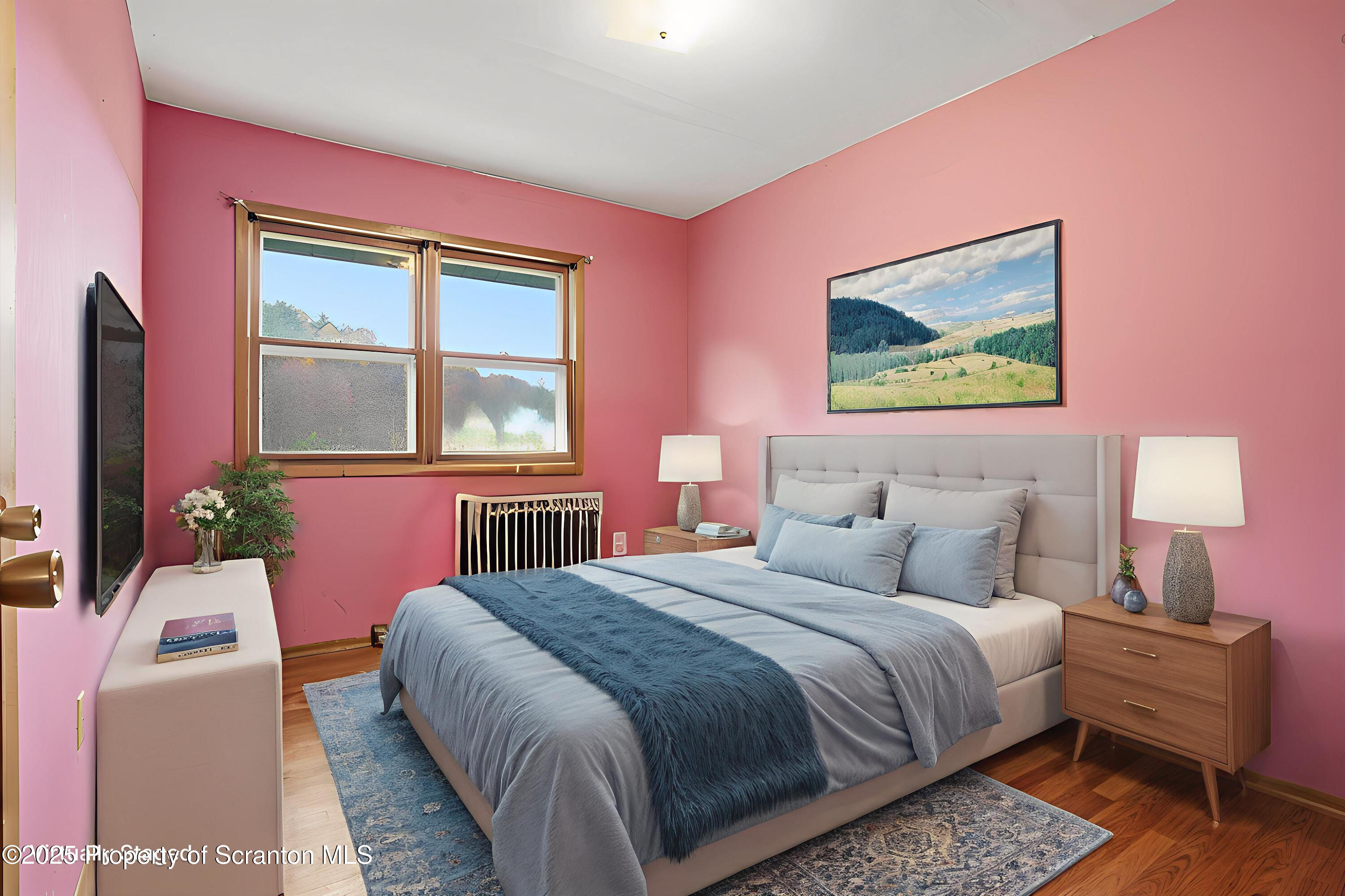 330 Pedrick Road Nicholson, PA 18446 - Photo 22 of 55 a bedroom with a bed and a flat screen tv