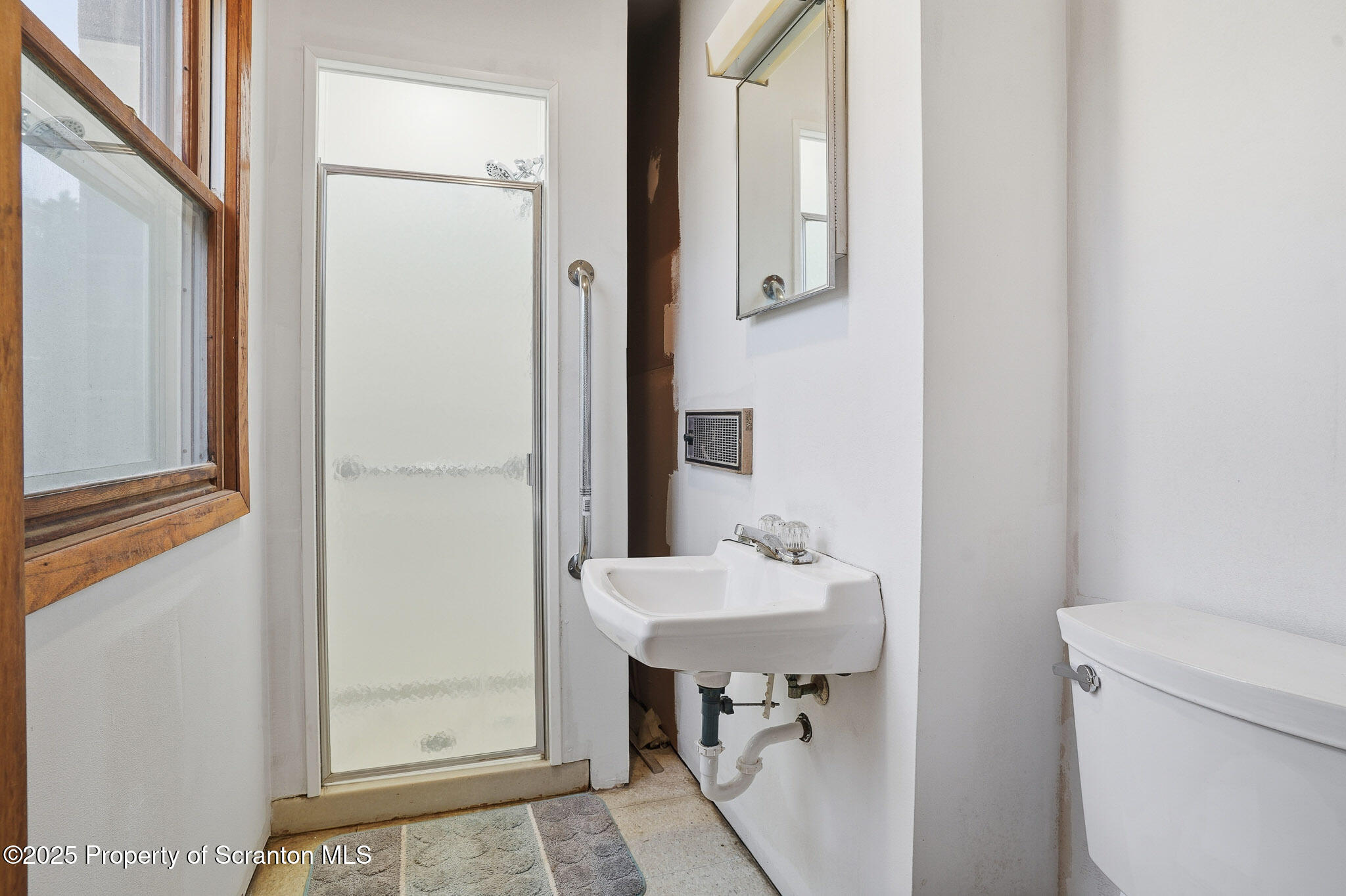 330 Pedrick Road Nicholson, PA 18446 - Photo 26 of 55 a bathroom with a sink a toilet and a mirror