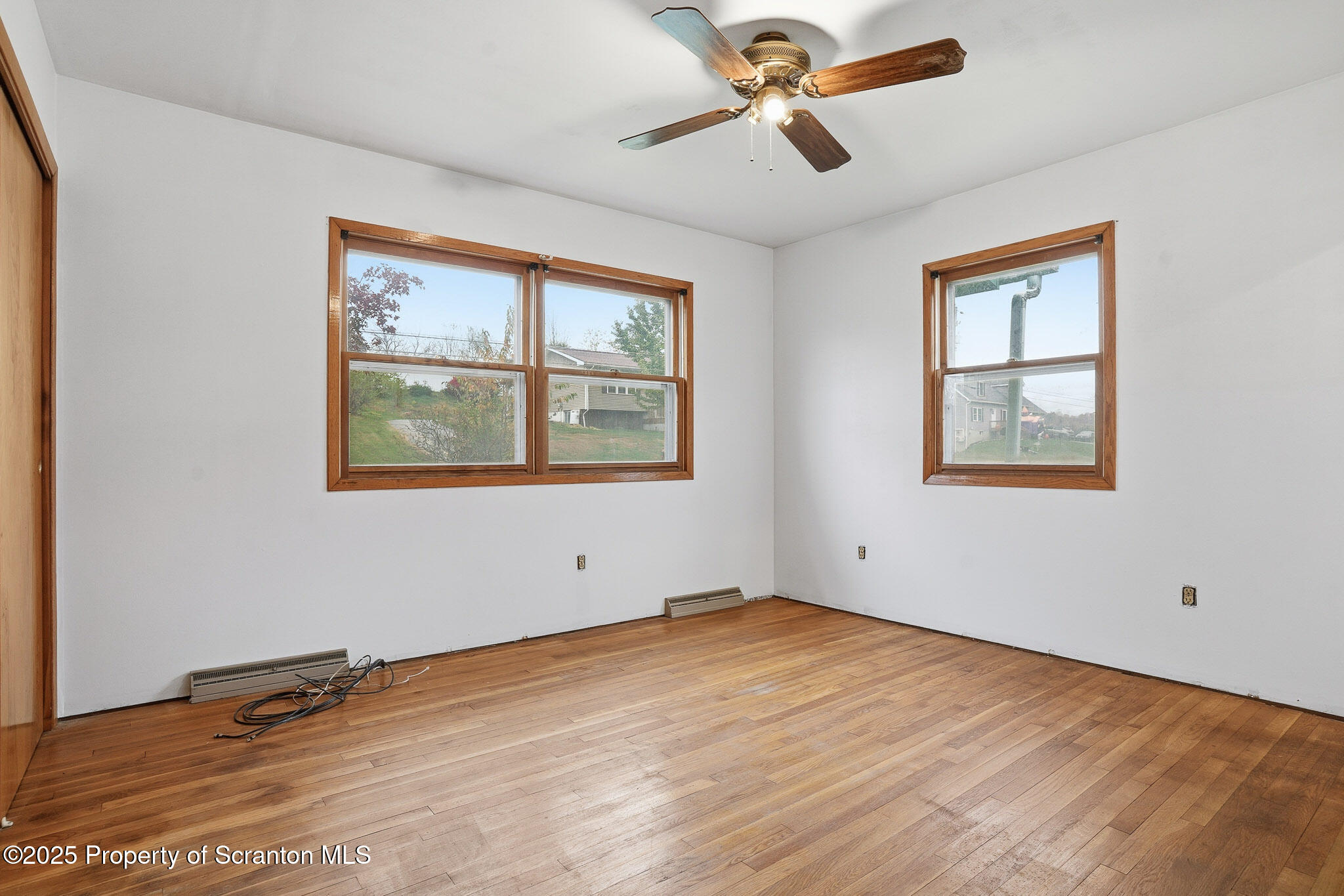 330 Pedrick Road Nicholson, PA 18446 - Photo 27 of 55 a view of empty room with wooden floor and fan