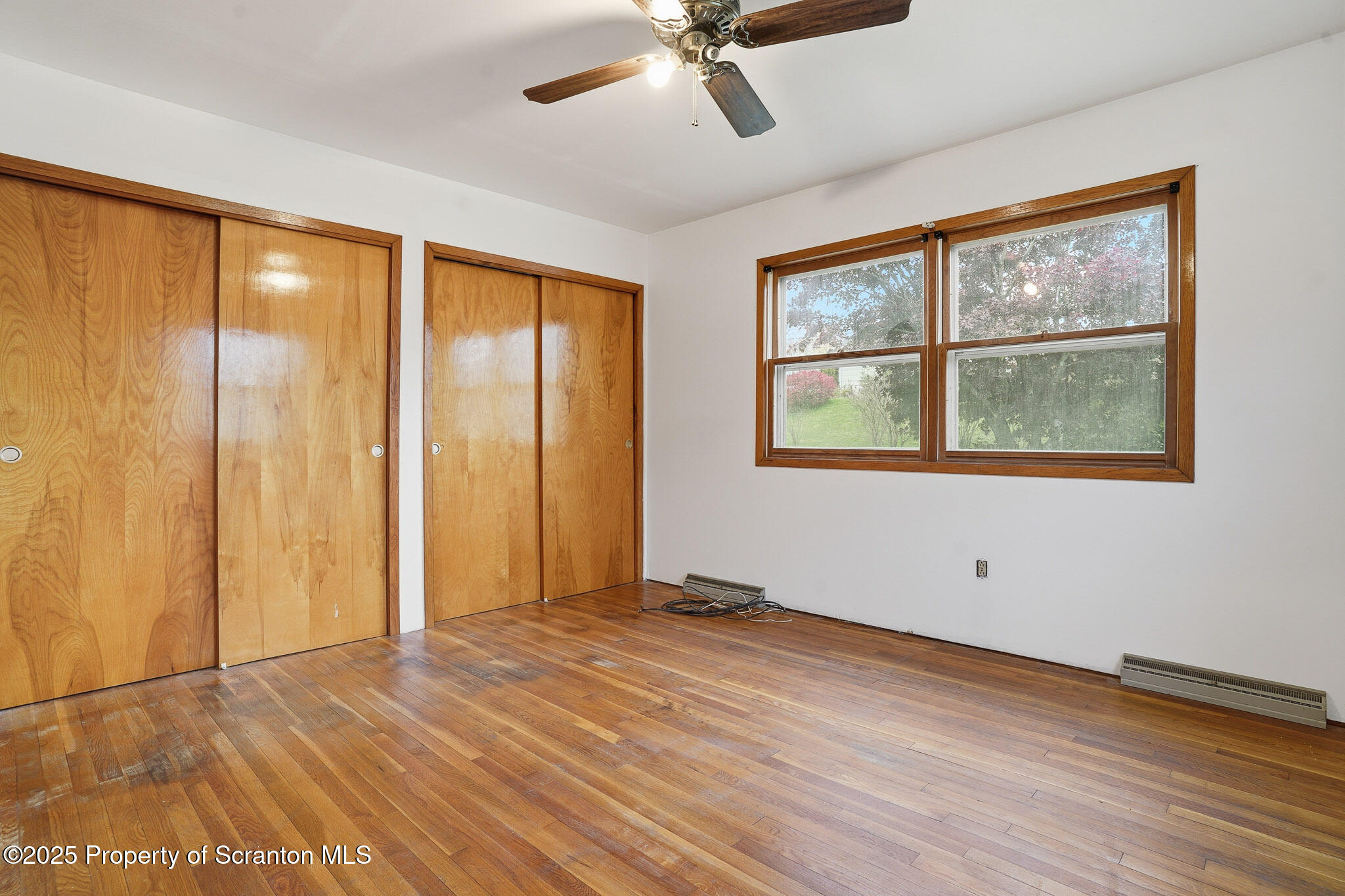 330 Pedrick Road Nicholson, PA 18446 - Photo 29 of 55 a view of an empty room with a window and wooden floor