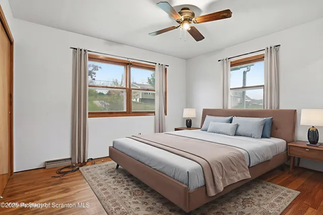 a bedroom with a large bed and a window