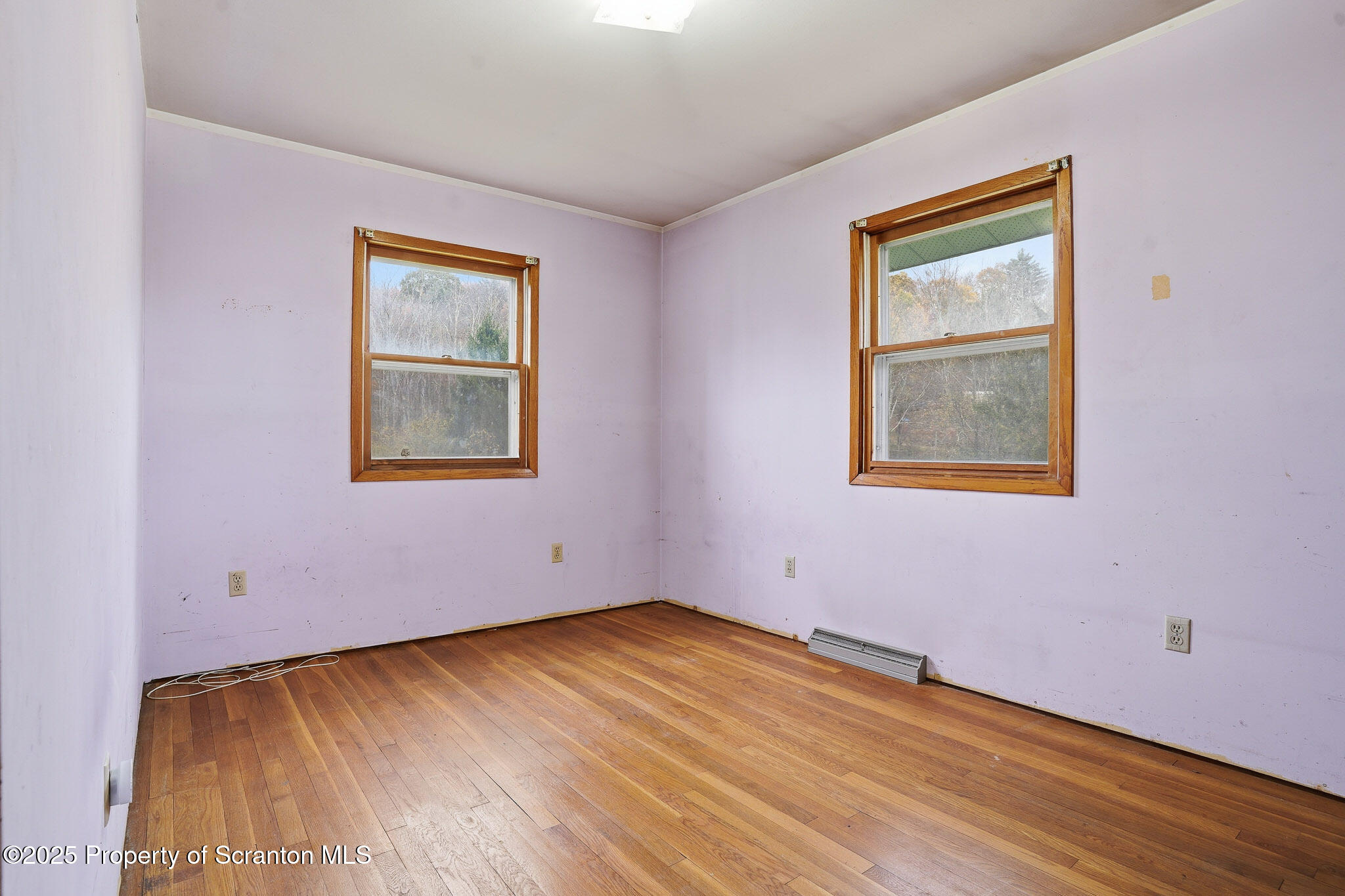 330 Pedrick Road Nicholson, PA 18446 - Photo 31 of 55 a view of an empty room with wooden floor and a window