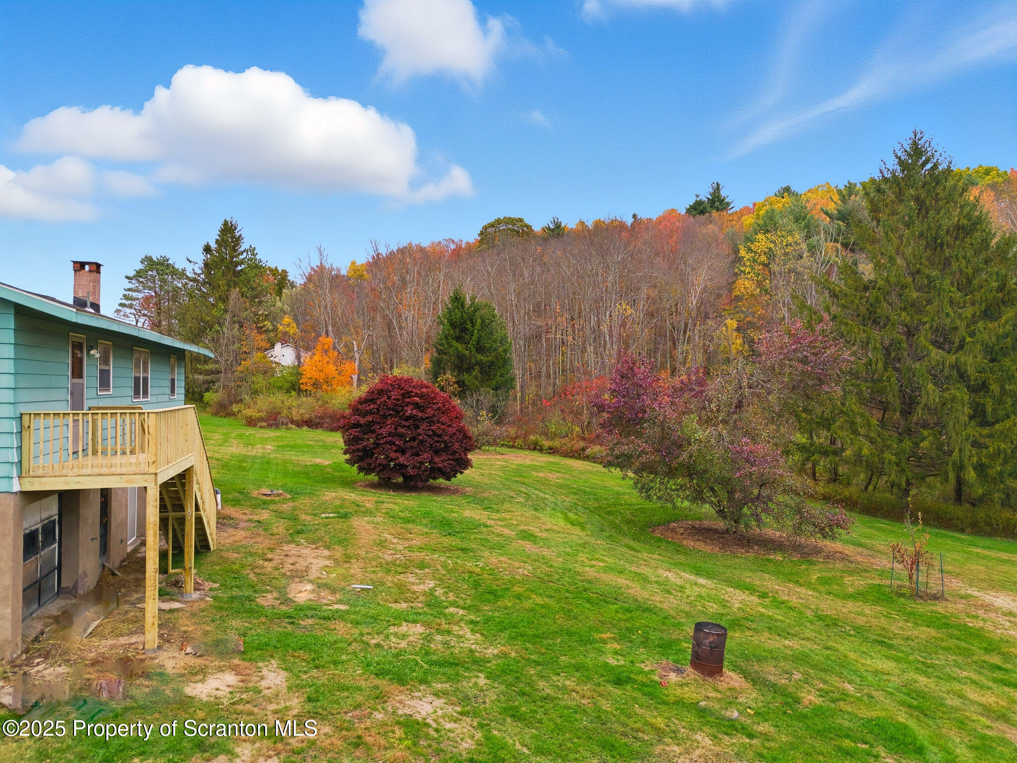 330 Pedrick Road Nicholson, PA 18446 - Photo 52 of 55 a view of backyard with table and chairs and a large tree