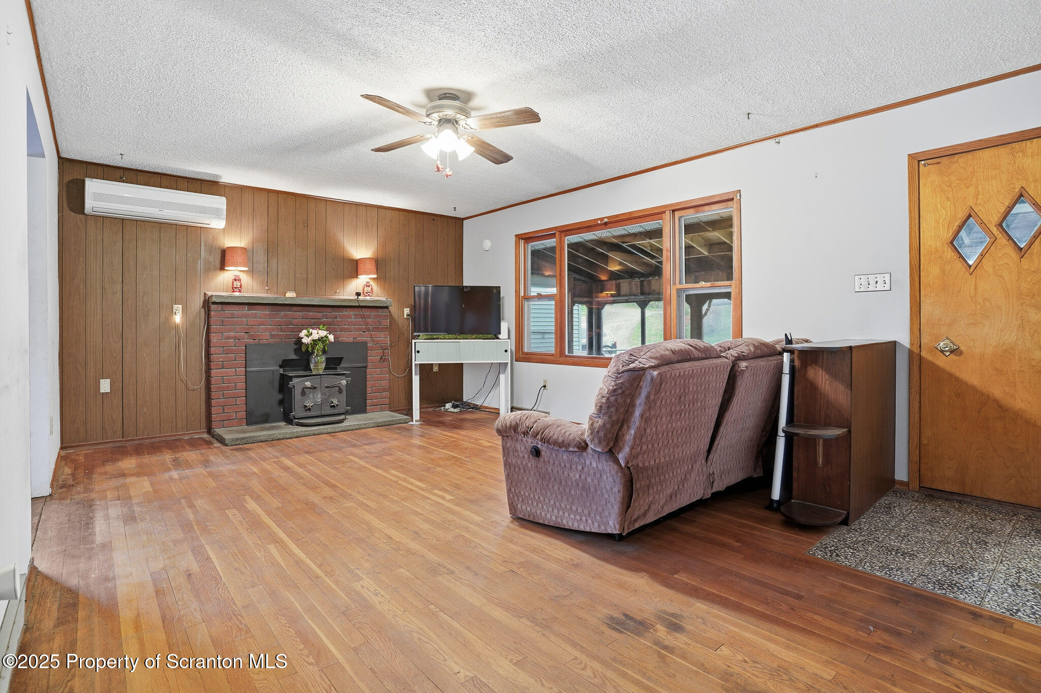 330 Pedrick Road Nicholson, PA 18446 - Photo 8 of 55 a living room with furniture and a fireplace