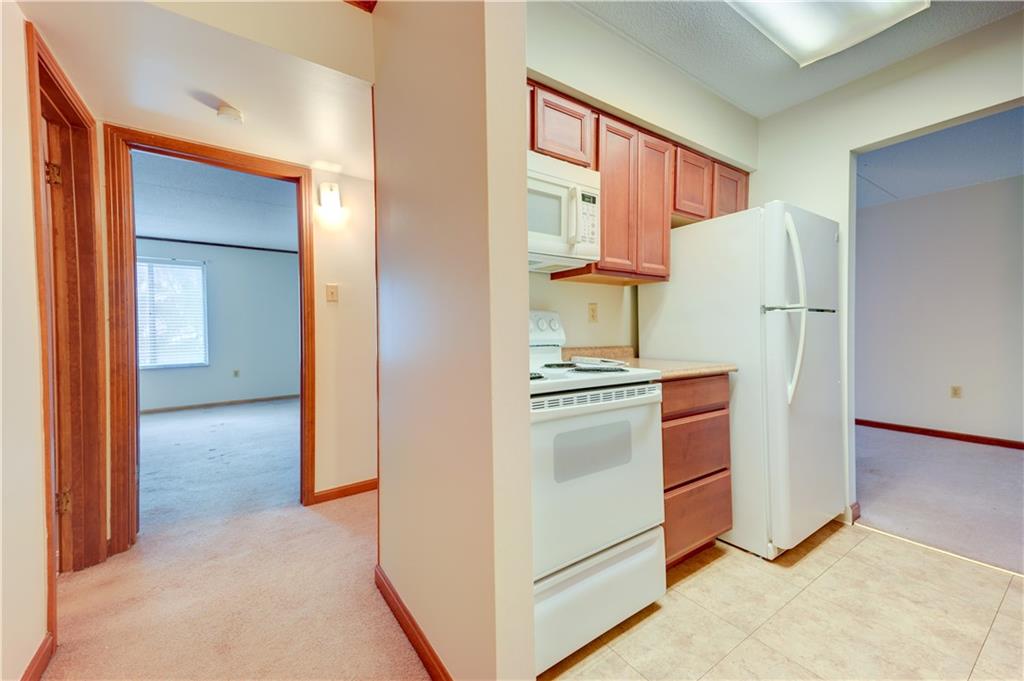 2160 Greentree Road, Unit 401W Pittsburgh, PA 15220 - Photo 9 of 23 a kitchen with a refrigerator and a stove