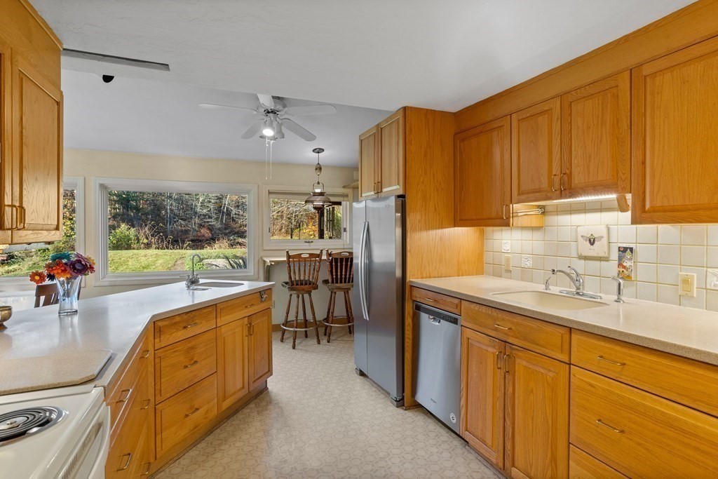 115 South Meadow Road Lancaster, MA 01523 - Photo 17 of 42 a kitchen with sink cabinets and window