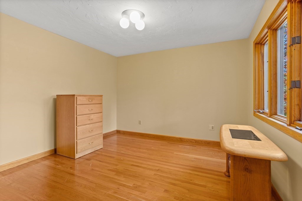 115 South Meadow Road Lancaster, MA 01523 - Photo 26 of 42 a view of an empty room with wooden floor and a window