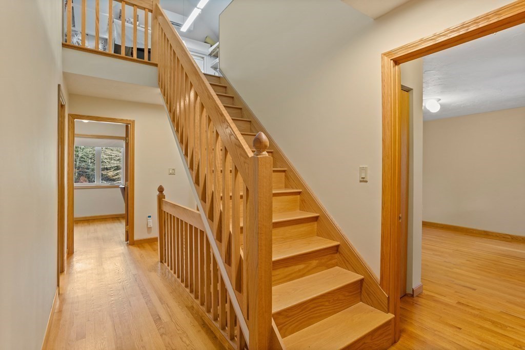 115 South Meadow Road Lancaster, MA 01523 - Photo 31 of 42 a view of staircase with railing and white walls