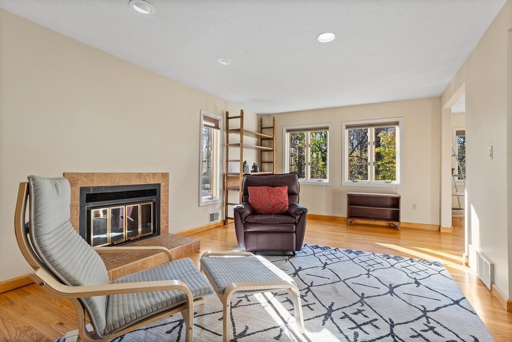 115 South Meadow Road Lancaster, MA 01523 - Photo 6 of 42 a living room with furniture and a fireplace