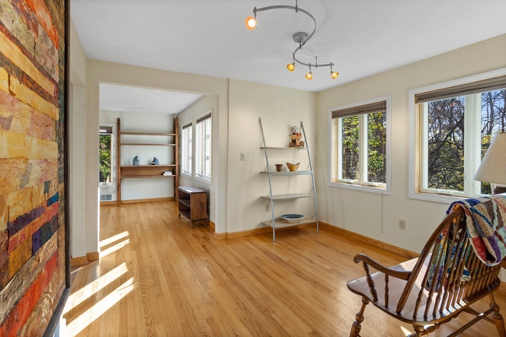 115 South Meadow Road Lancaster, MA 01523 - Photo 7 of 42 a view of a livingroom with furniture wooden floor and windows