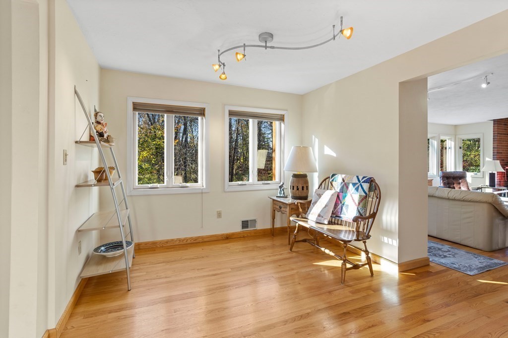 115 South Meadow Road Lancaster, MA 01523 - Photo 8 of 42 a living room with furniture window and wooden floor