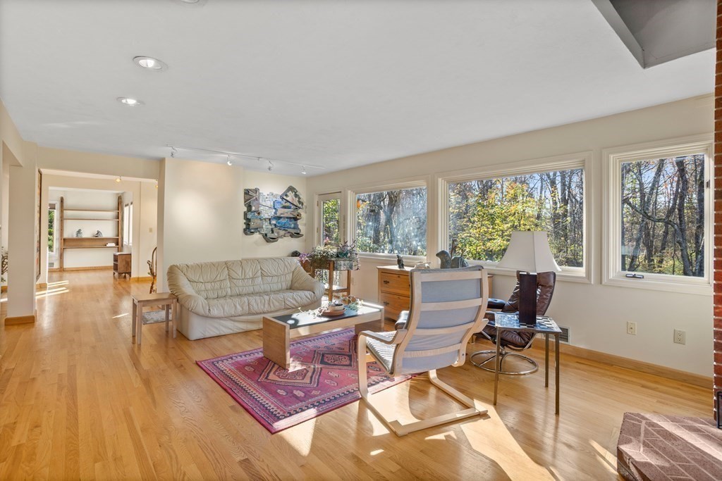 115 South Meadow Road Lancaster, MA 01523 - Photo 9 of 42 a living room with furniture and a large window