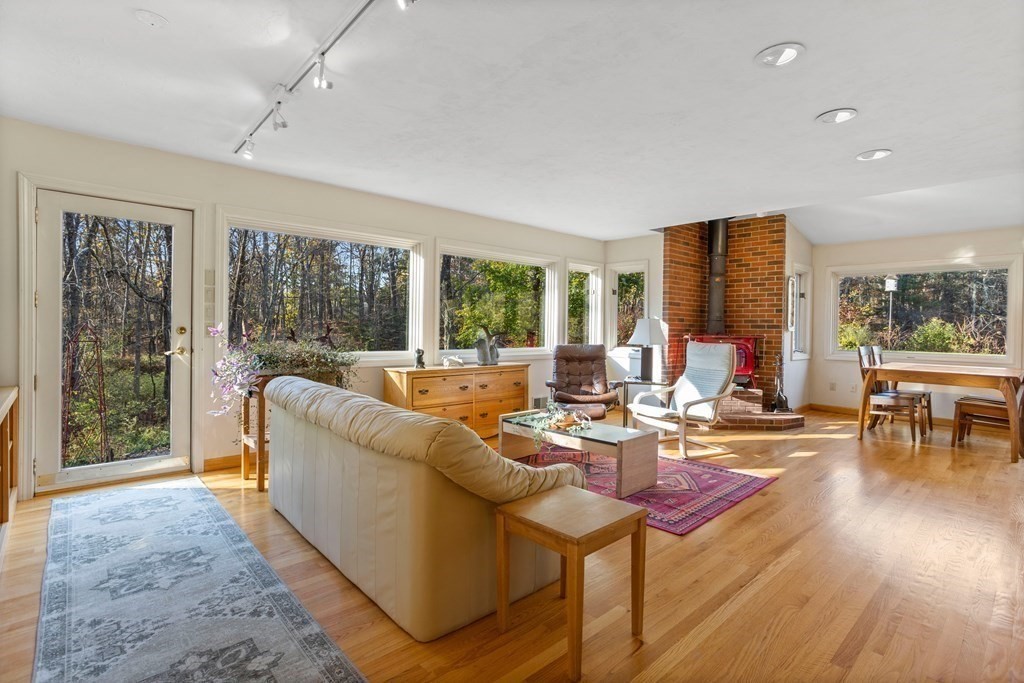 115 South Meadow Road Lancaster, MA 01523 - Photo 10 of 42 a living room with furniture and a large window