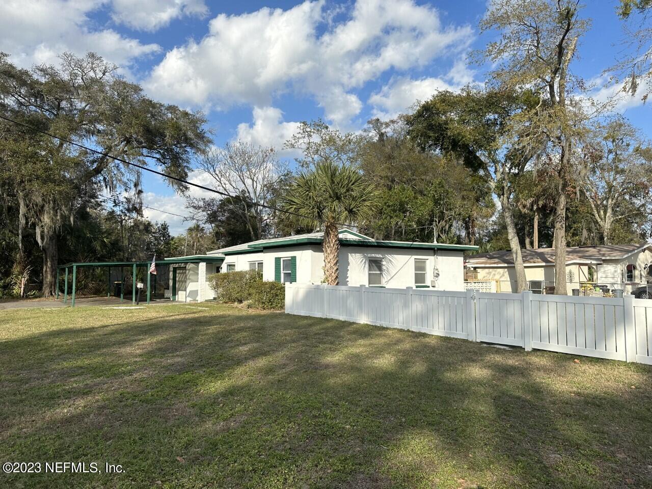 6021 Colgate Road Jacksonville, FL 32217 - Photo 6 of 32 a view of a backyard with large trees