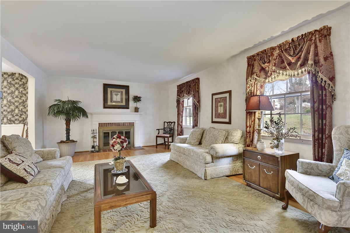 8235 Burnley Road Baltimore, MD 21204 - Photo 5 of 30 Living Room w/ Fireplace & Hardwood floors