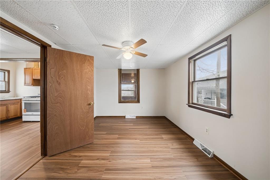 504 Fair Oaks Street McKees Rocks, PA 15136 - Photo 16 of 35 wooden floor in an empty room with a window