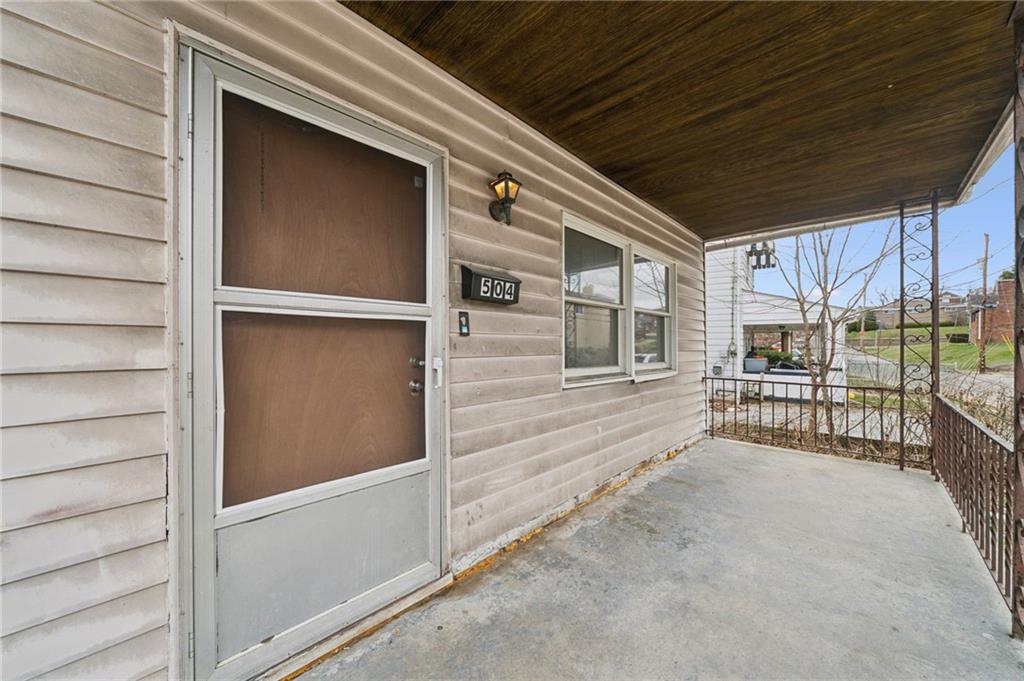 504 Fair Oaks Street McKees Rocks, PA 15136 - Photo 2 of 35 a view of a house with a large window