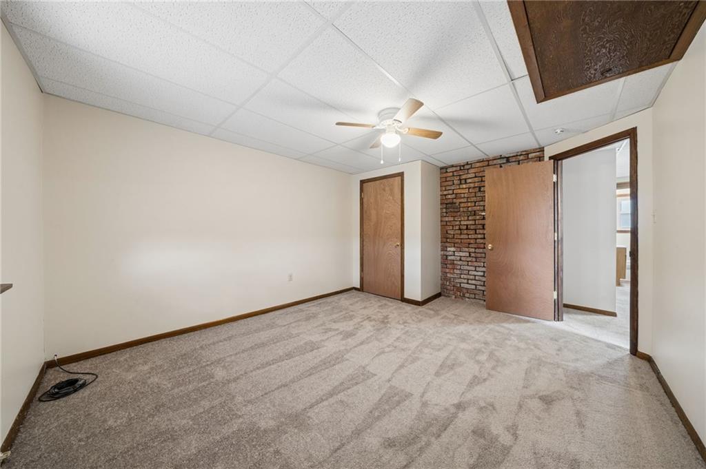 504 Fair Oaks Street McKees Rocks, PA 15136 - Photo 21 of 35 an empty room with closet and a ceiling fan