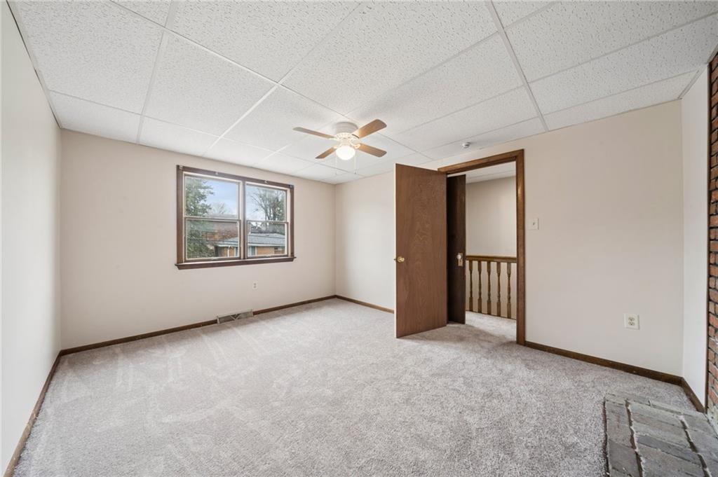 504 Fair Oaks Street McKees Rocks, PA 15136 - Photo 24 of 35 an empty room with windows and fan