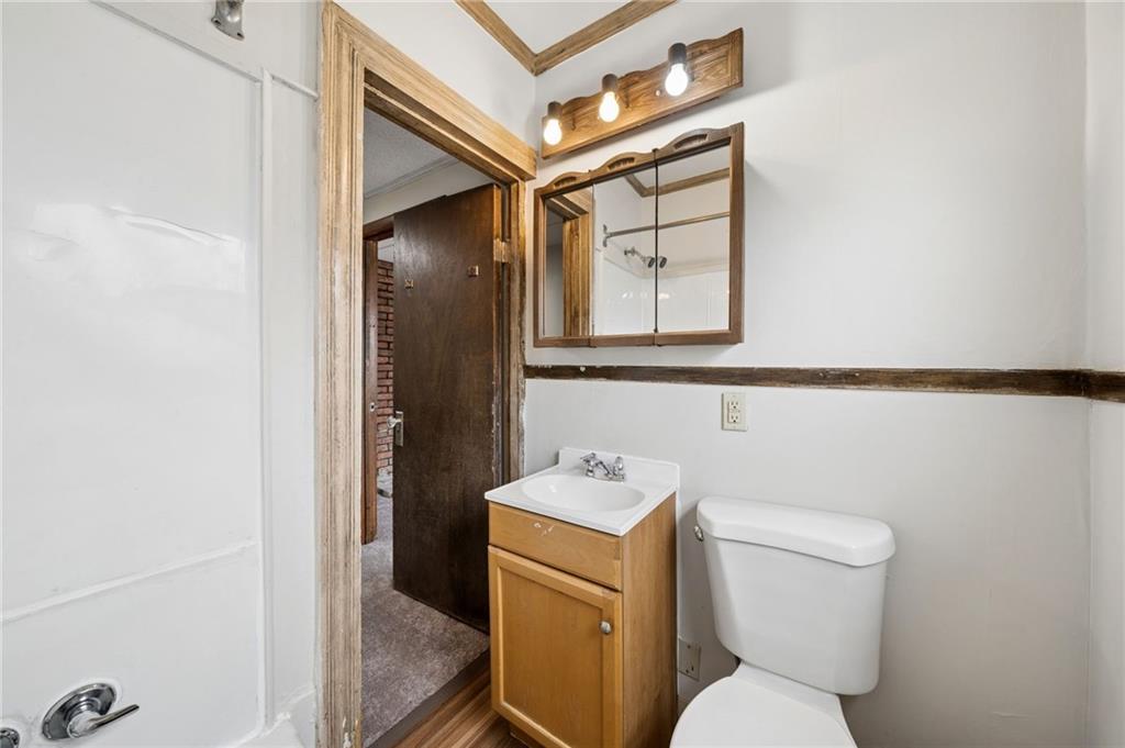 504 Fair Oaks Street McKees Rocks, PA 15136 - Photo 27 of 35 a white toilet sitting next to a bathroom sink