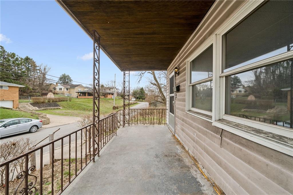 504 Fair Oaks Street McKees Rocks, PA 15136 - Photo 3 of 35 a view of a porch with wooden floor next to a yard