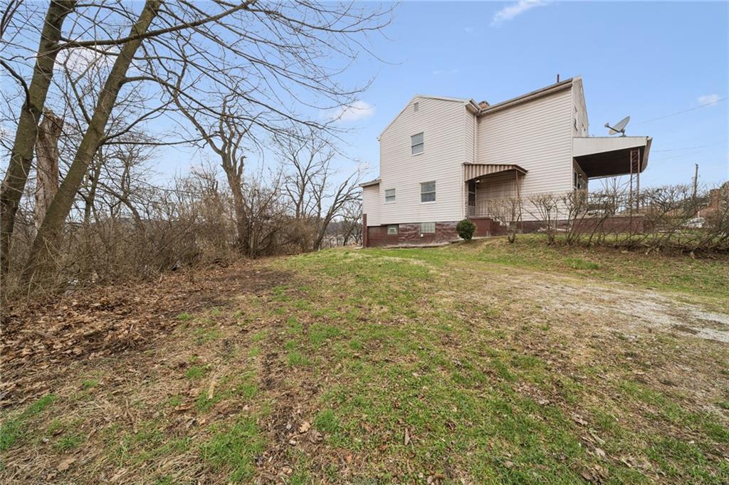 504 Fair Oaks Street McKees Rocks, PA 15136 - Photo 31 of 35 a view of a house with a yard