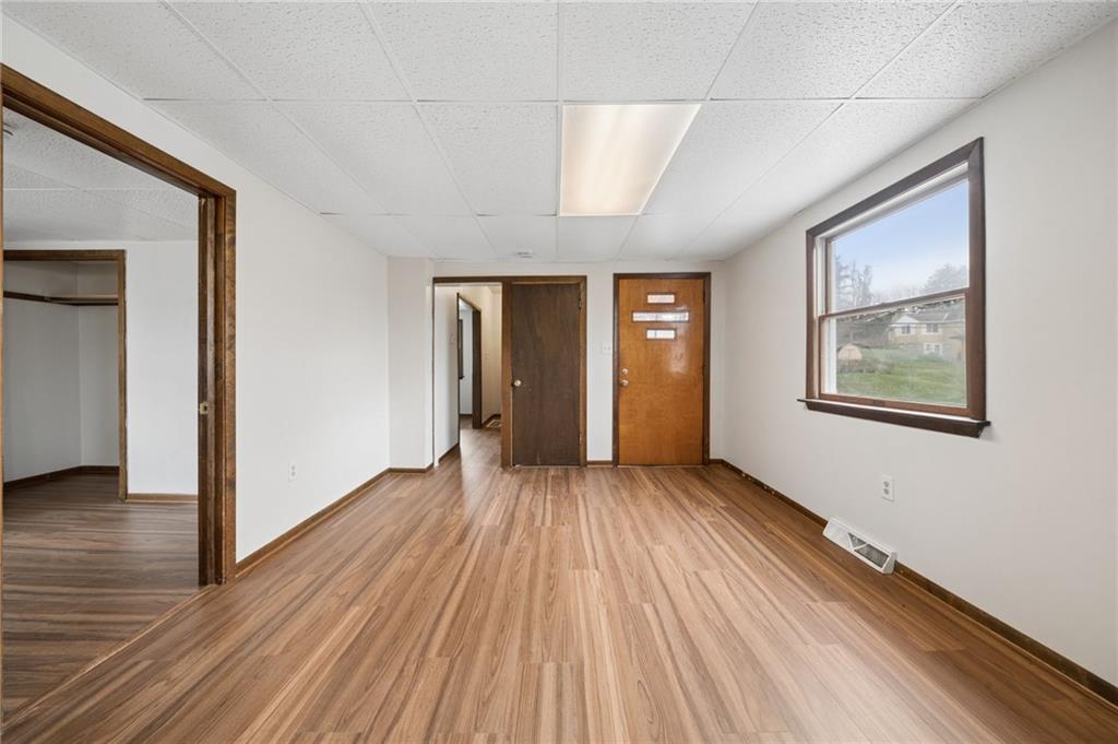 504 Fair Oaks Street McKees Rocks, PA 15136 - Photo 10 of 35 a view of an empty room with wooden floor