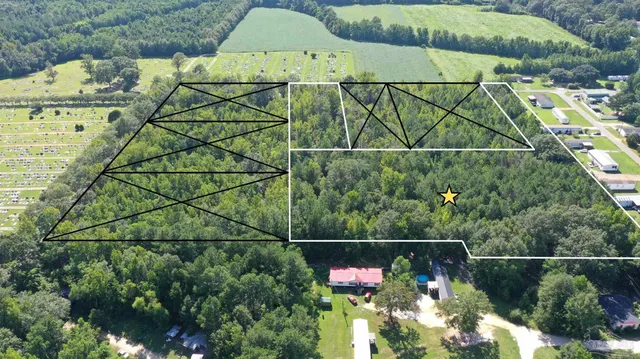 an aerial view of houses with street