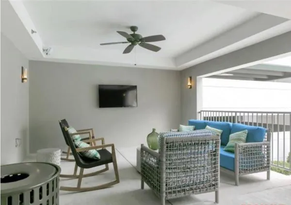 a bedroom with furniture and a window