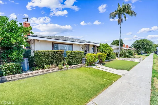 a house view with a garden space