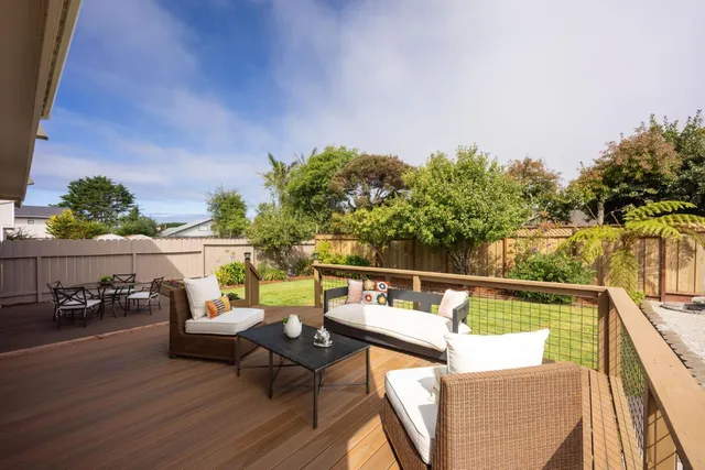 a view of sitting area with furniture and lake view