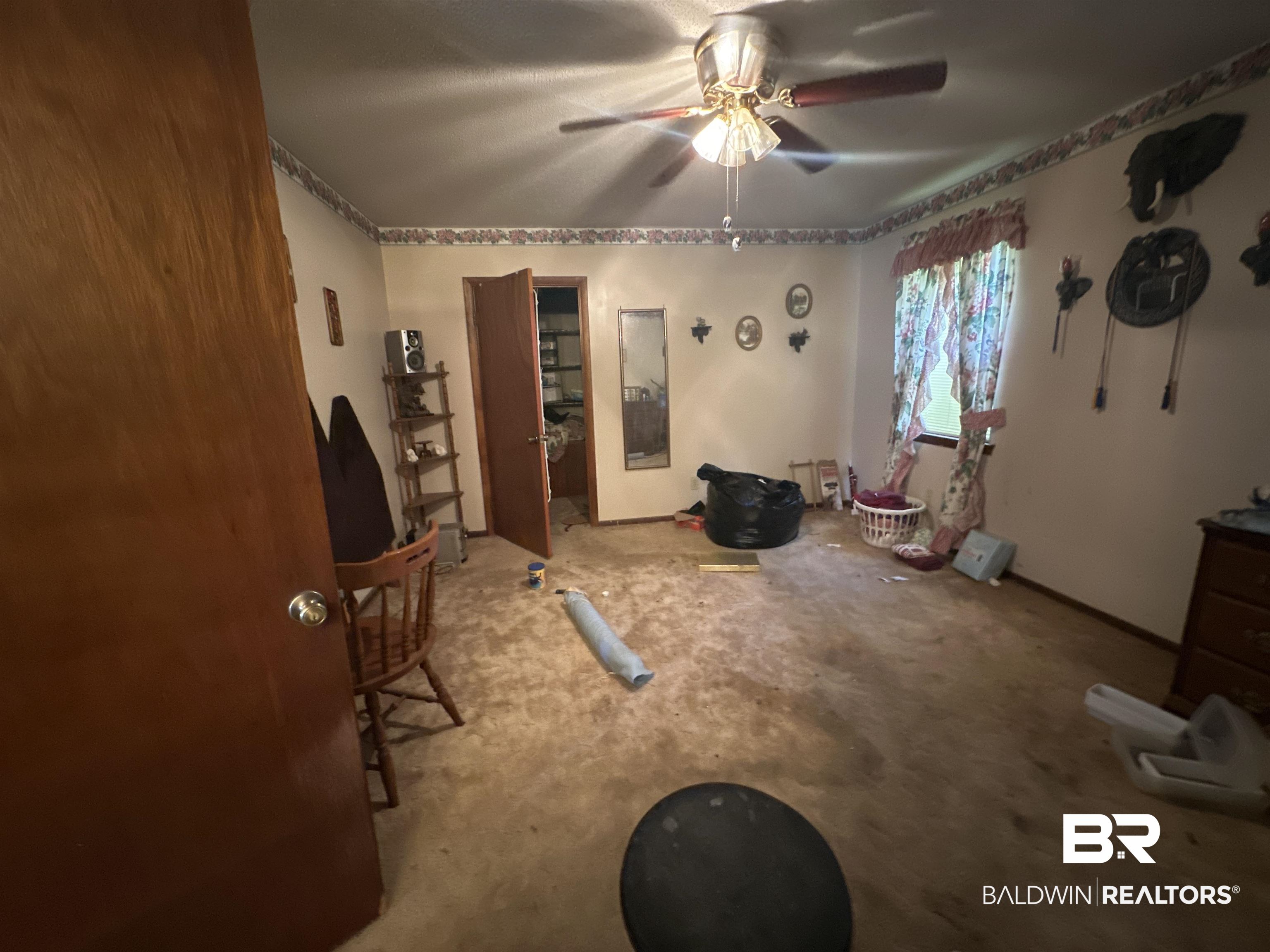 9520 C Four Mile Road Irvington, AL 36544 - Photo 9 of 32 Misc room with ceiling fan and carpet