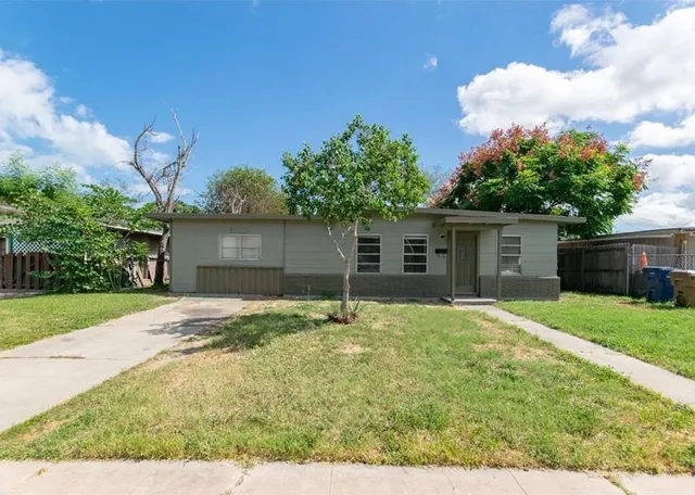 a house view with a backyard space