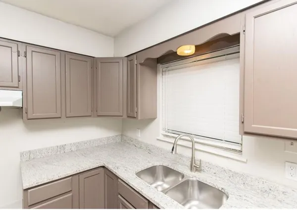 a kitchen with a sink and a cabinets