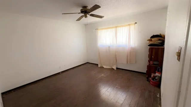 a living room with a wooden floor