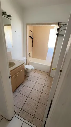 a reading room with furniture and a window