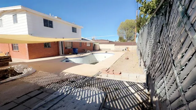 a view of a backyard with patio