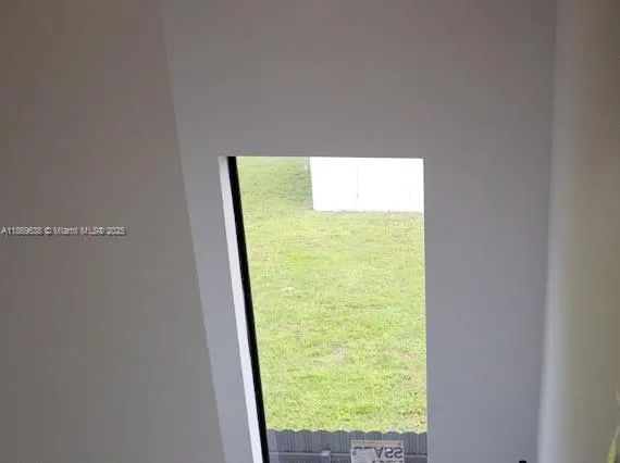 a view of a room with a window