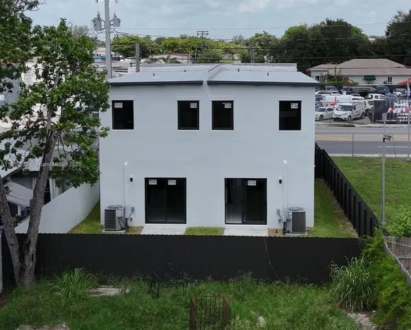 a aerial view of a house with a yard