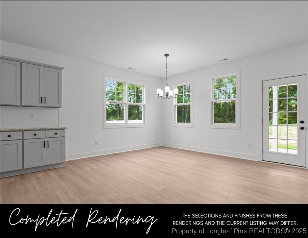 3563 Philippi Church Road Raeford, NC 28376 - Photo 4 of 11 a view of an empty room with window and wooden floor