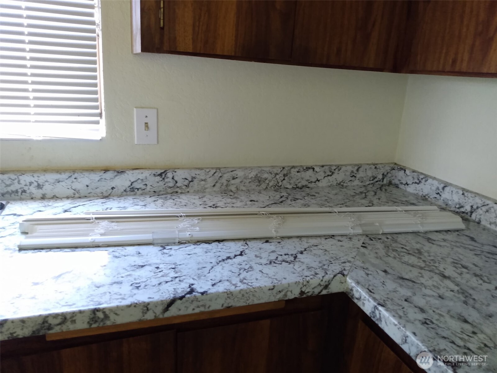 439 Southwest 156th Street Burien, WA 98166 - Photo 12 of 17 a view of wooden cabinets and a stove