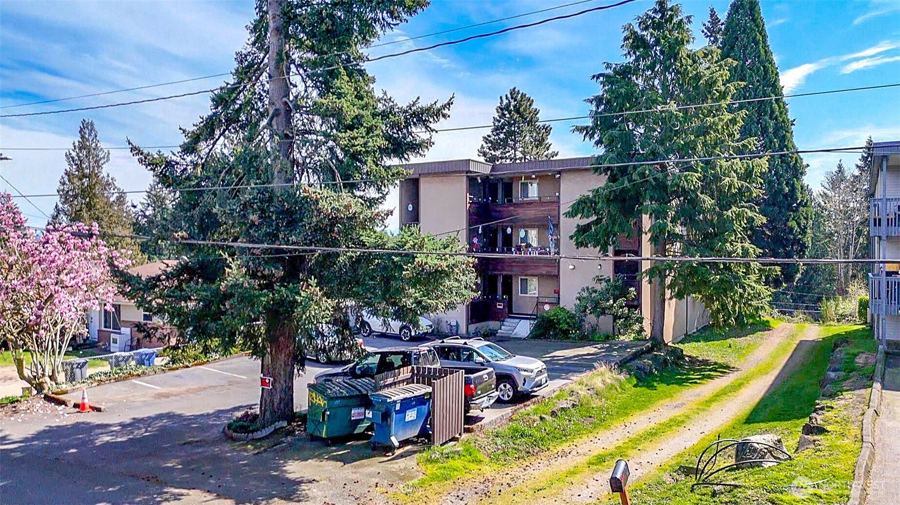 439 Southwest 156th Street Burien, WA 98166 - Photo 4 of 17 a view of a house with backyard outdoor seating and hardwood
