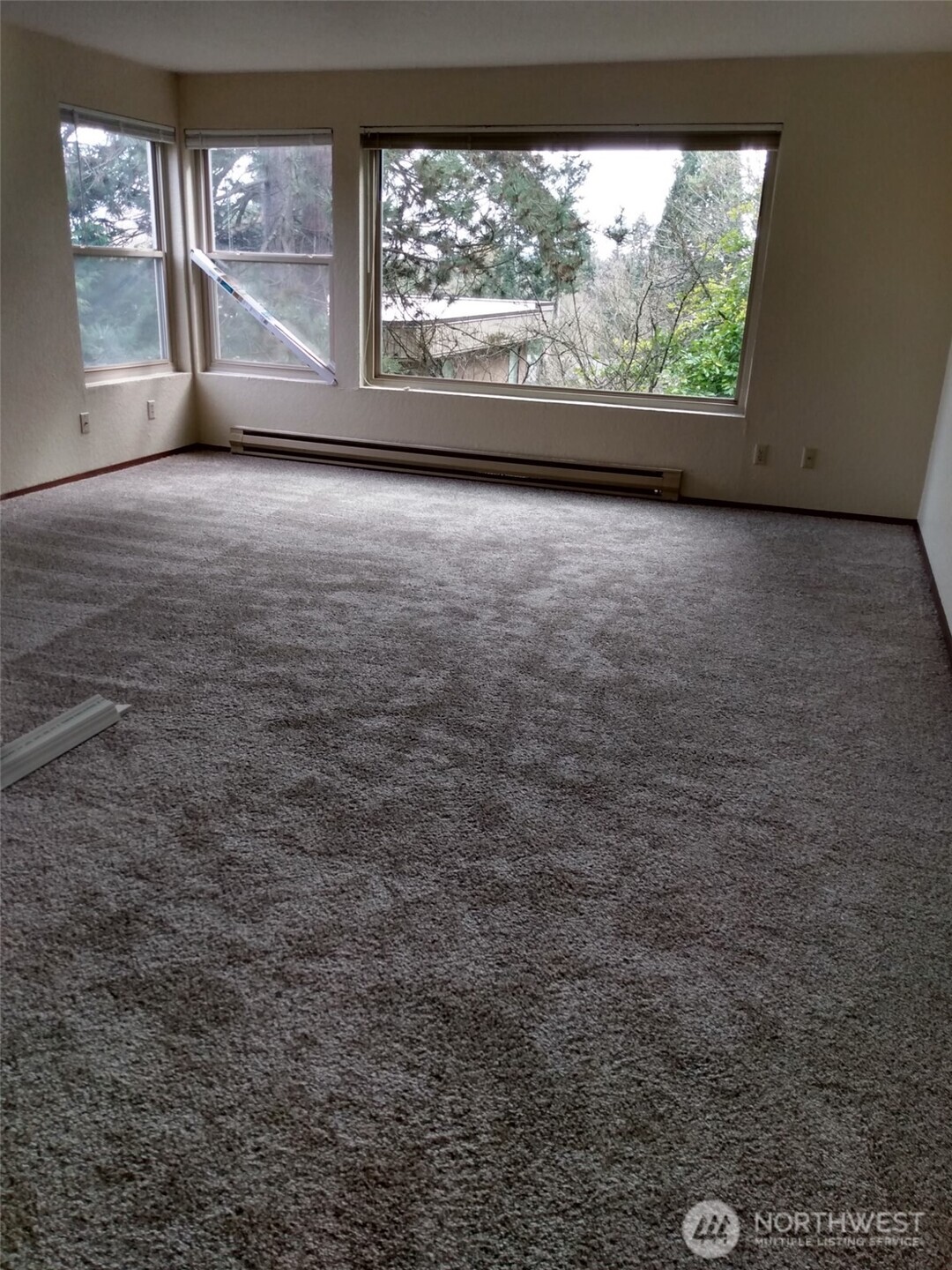 439 Southwest 156th Street Burien, WA 98166 - Photo 8 of 17 wooden floor in an empty room with a window