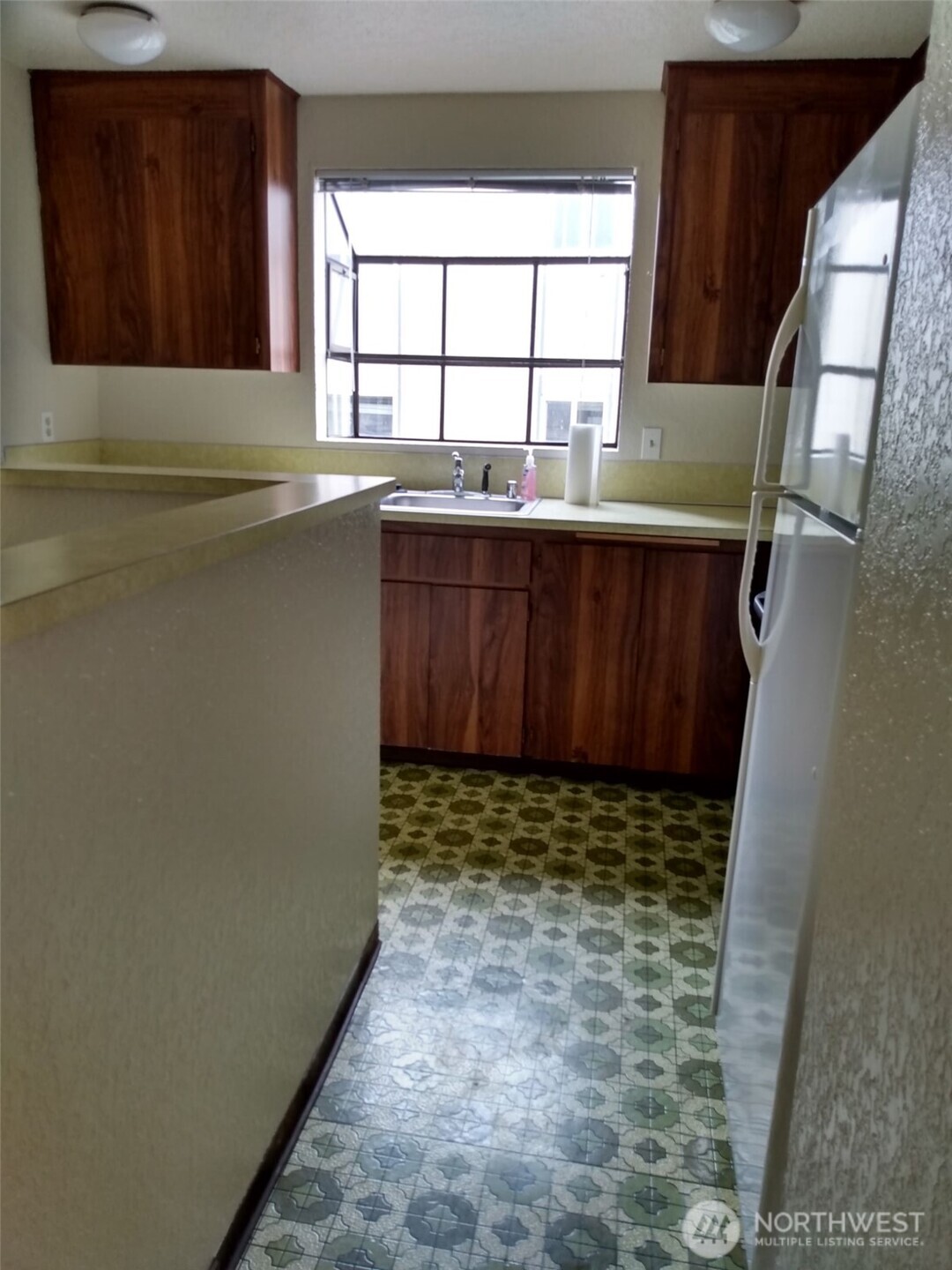 439 Southwest 156th Street Burien, WA 98166 - Photo 9 of 17 a bathroom with a sink and a large window